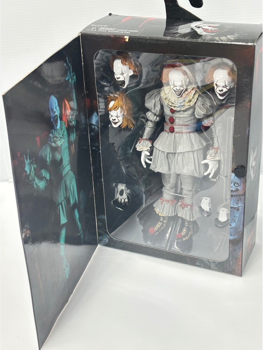 NECA IT Pennywise Action Figure with Interchangeable Heads & Hands Collectible